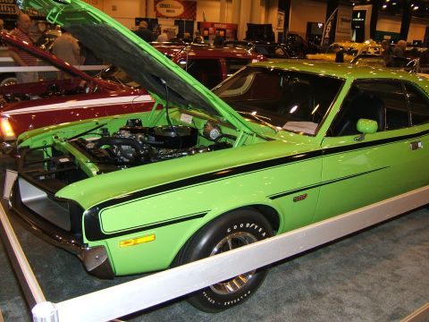 2012 Ford Crown Victoria - This lime green muscle car is displayed with its hood open, revealing the engine bay.