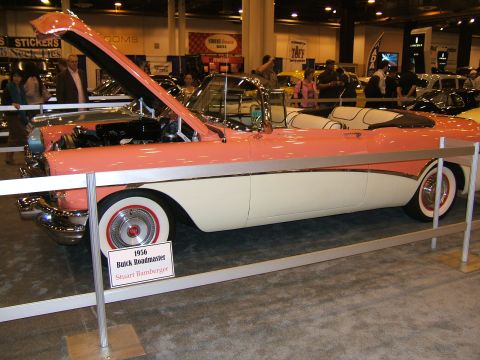 2012 Ford Crown Victoria - 1956 Buick Roadmaster convertible on display at an auto show.