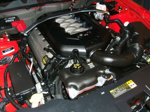 2012 Ford Crown Victoria - Close-up view of a V8 engine bay, showing intake manifold and other engine parts.