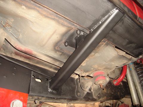 1989 Ford Bronco - Aftermarket frame reinforcement installed on a vehicle's undercarriage.