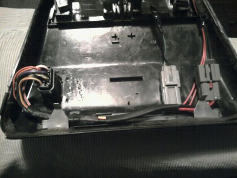 1993 Ford Taurus - Close-up of an interior car part showing electrical connectors and wiring.