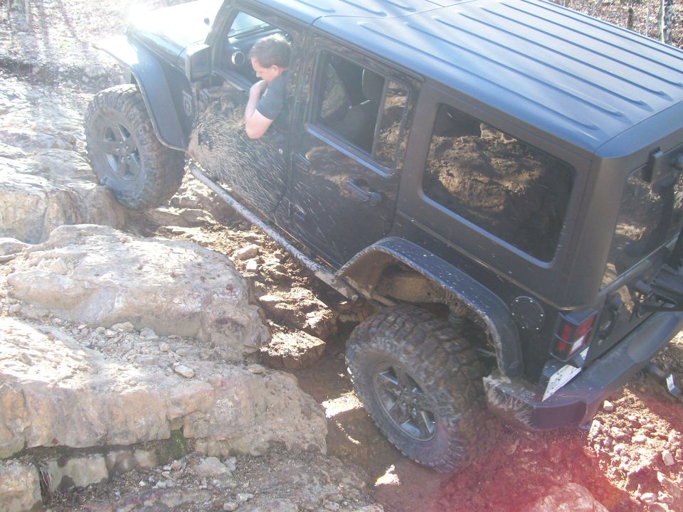 Black 2007 Jeep Wrangler navigating rocky terrain