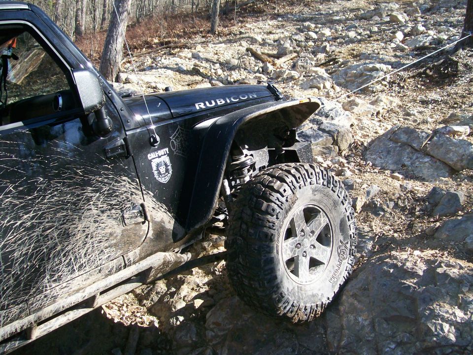 Black 2007 Jeep Wrangler Rubicon with Call of Duty decal on rocky terrain