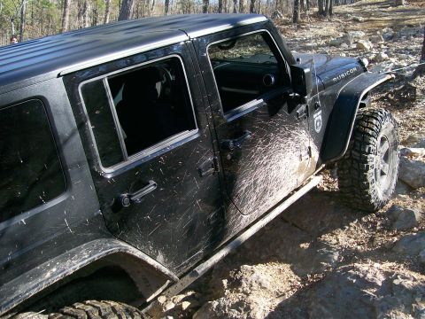 2007 Jeep Wrangler - This 2007 Jeep Wrangler Rubicon is shown navigating a rocky trail, covered in mud.