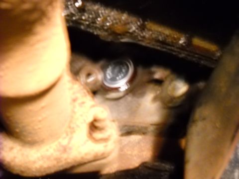 1993 Ford C-150 (Centurion Conversions) - A freeze plug is visible in this close-up mechanical view. The registry information may be incorrect.