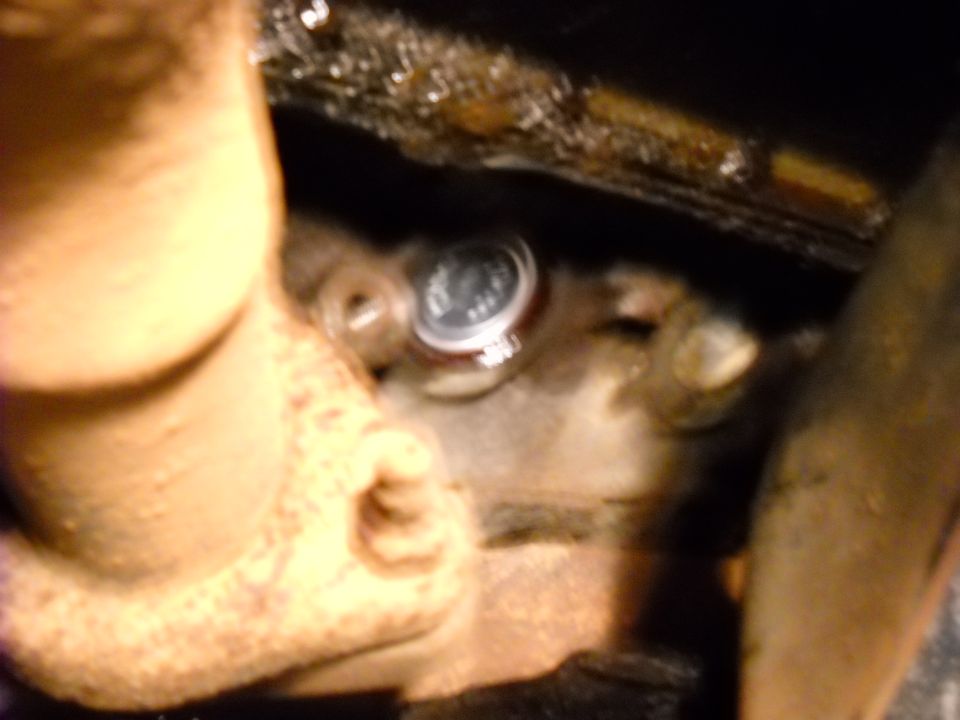 Close-up of a freeze plug with visible text