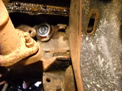 1993 Ford C-150 (Centurion Conversions) - Engine freeze plug detail, showing installation in the block near the exhaust.