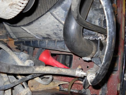 1993 Ford C-150 (Centurion Conversions) - A red funnel is visible in the engine bay, positioned near the radiator and various hoses.
