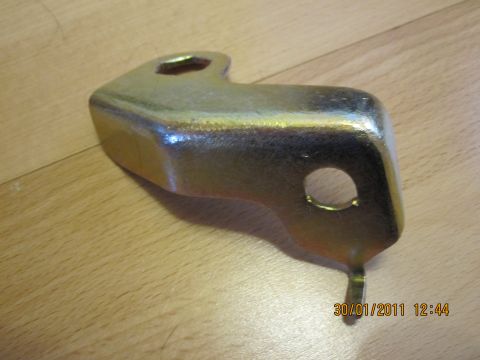 1973 Ford Ranchero - A single metal bracket, possibly a component for a vehicle, is shown against a wooden background. The date 30/01/2011 is visible.