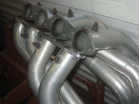 1965 Ford Fairlane - Polished exhaust headers, likely aftermarket performance parts, are shown in detail.
