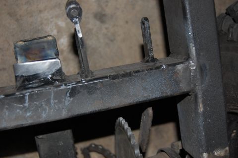 2010 Kawasaki BAYOU 220 - This is a close-up view of a welded metal frame part, possibly from an ATV or motorcycle.