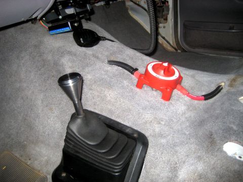 1996 Ford Bronco - Interior view of a vehicle shows a floor shifter, a red battery disconnect switch, and a CB radio mounted on the dashboard.