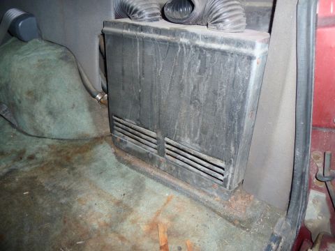 1993 Ford C-150 (Centurion Conversions) - Aftermarket heater unit and ducting visible in the interior of a vehicle.