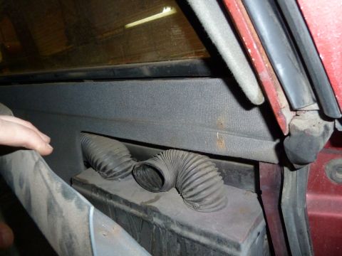 1993 Ford C-150 (Centurion Conversions) - Interior view of flexible vent hoses, possibly from a vehicle's HVAC system.