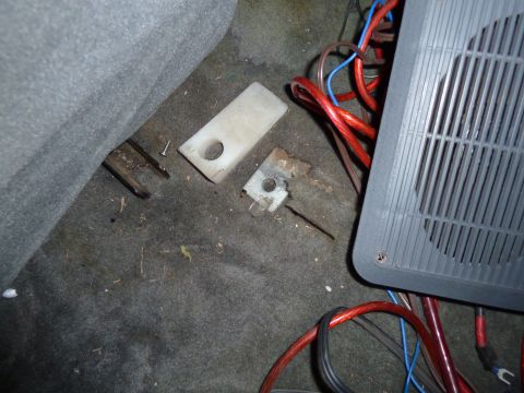 1993 Ford C-150 (Centurion Conversions) - The interior floor shows wiring, a speaker, and mounting hardware, suggesting aftermarket modifications.