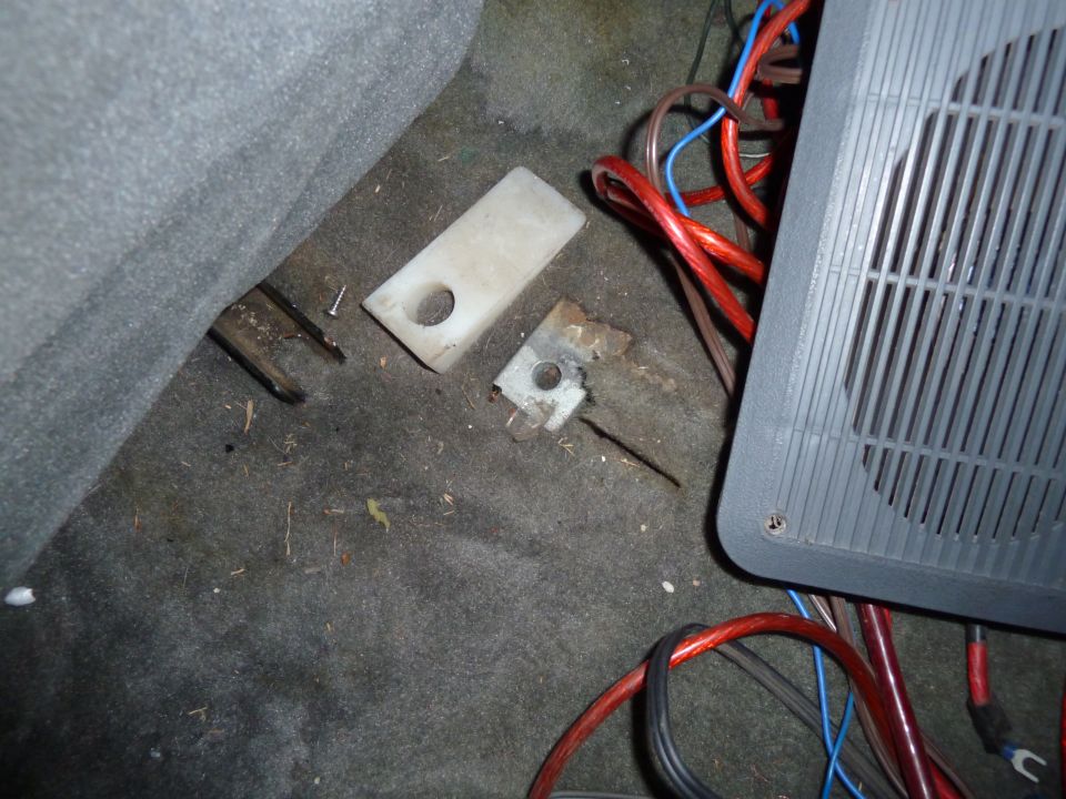Interior floor with speaker, wiring, and mounting hardware
