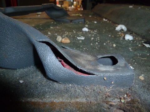 1993 Ford C-150 (Centurion Conversions) - Interior trim panel is ripped, revealing red material underneath.