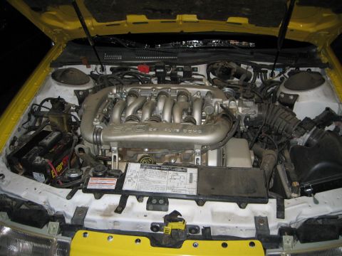 2002 Ford Taurus - Engine bay of a Ford SHO V6, likely from a 2002 model year vehicle.