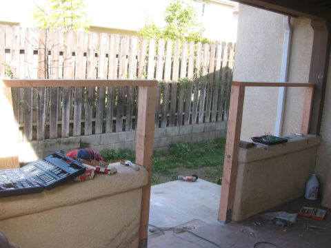 1968 Ford Mustang - Tools and lumber are laid out on a patio, suggesting ongoing construction or repair work.