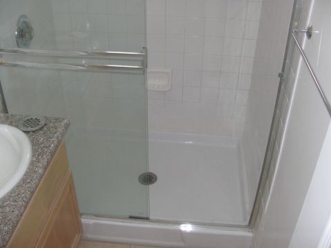 1968 Ford Mustang - Interior view of a bathroom shower stall and vanity area.
