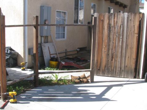 1968 Ford Mustang - A backyard scene shows construction in progress with power tools and unfinished fencing.