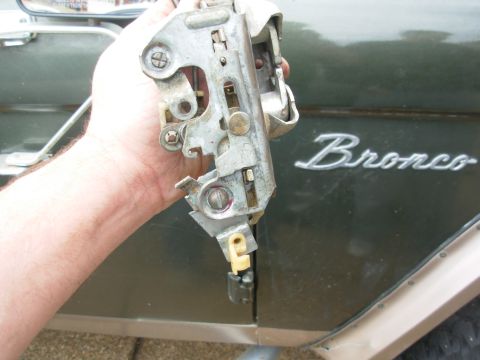 1976 Ford Bronco - With the bolt reversed, there is no interference with the lock slide. The nut has red threadlocker to prevent it from vibrating loose.