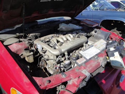 1993 Ford Taurus - Engine bay of a 1993 Ford Taurus SHO, showing the V6 engine and intake system.