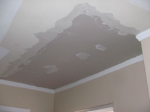 1968 Ford Mustang - Ceiling damage requires repair work, with peeling paint and visible drywall patches.