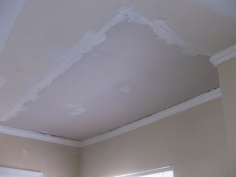 1968 Ford Mustang - The ceiling shows areas of recent repair work, with visible patching compound applied to cracks.