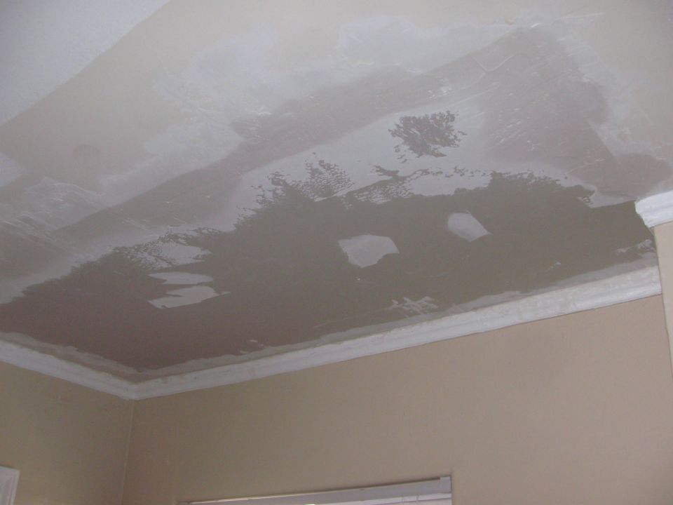Ceiling with drywall patches and crown molding