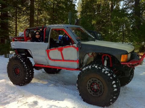 1989 Ford Bronco - This heavily modified pickup truck is equipped for off-road adventures in a snowy environment.
