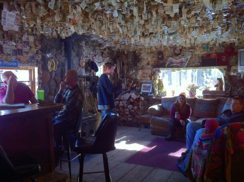 1989 Ford Bronco - Rustic bar interior decorated with numerous dollar bills on the ceiling and walls.