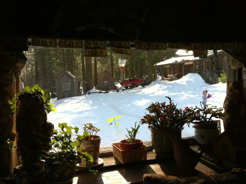 1989 Ford Bronco - A red pickup truck is visible in a snowy landscape outside a rustic cabin.