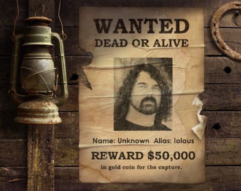 1990 Ford Bronco - A wanted poster displays a man's photograph and a reward for his capture.