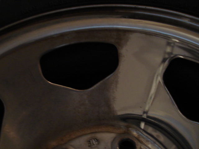 close-up of a chrome wheel with five spokes