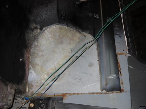 1993 Ford C-150 (Centurion Conversions) - Close-up of a vehicle's interior metal panel, showing rust and wiring.