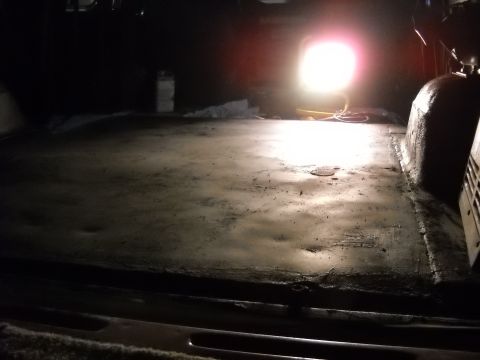 1993 Ford C-150 (Centurion Conversions) - The interior floor of a vehicle is visible, lit by a bright work light.