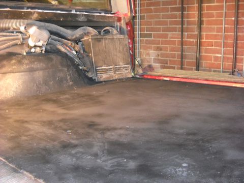 1993 Ford C-150 (Centurion Conversions) - Interior view of a truck bed with visible HVAC components and hoses.