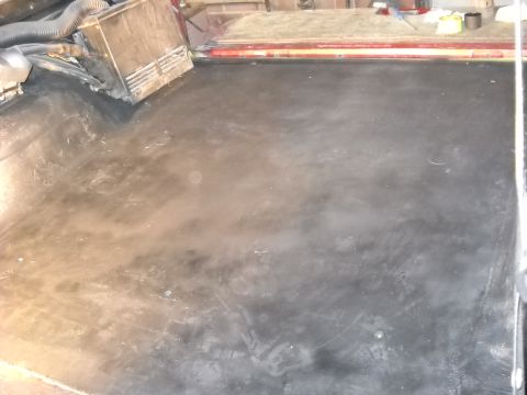 1993 Ford C-150 (Centurion Conversions) - The interior floor of a vehicle shows wear and tear, with some equipment visible on the side.