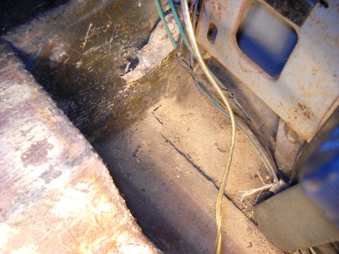 1993 Ford C-150 (Centurion Conversions) - Wiring and floor pan details visible in the interior of a vehicle.