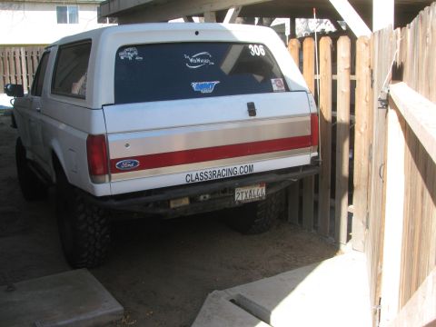 1968 Ford Mustang - This Ford Bronco has a custom bumper and stickers on the rear window.