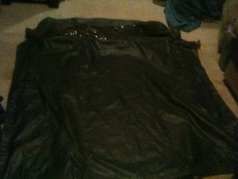 1993 Ford Bronco - A dark tarp obscures the subject, making identification impossible.