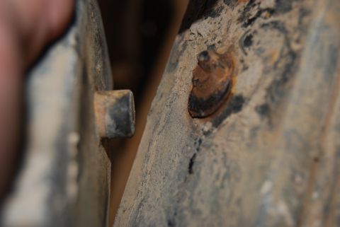 1982 Ford Bronco - A close-up view of a rusty bolt and textured metal, with the Supermotors website visible at the bottom right.