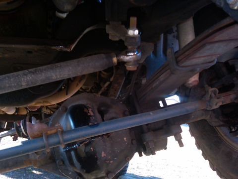1988 Ford Bronco - Undercarriage detail of a 1988 Ford Bronco, highlighting the suspension and steering components.