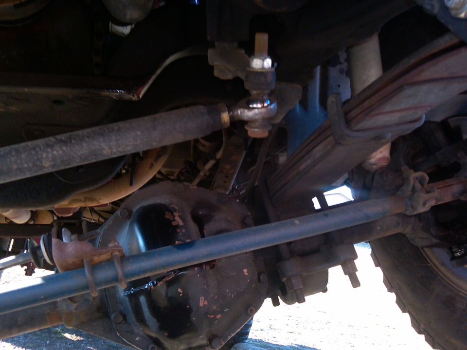 Undercarriage view of a 1988 Ford Bronco showing leaf springs and steering linkage