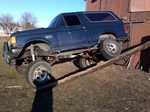 1988 Ford Bronco - This 1988 Ford Bronco is shown with its suspension flexed as it climbs a ramp.