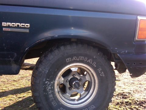 1988 Ford Bronco - Close-up of a 1988 Ford Bronco XLT's side fender and tire.