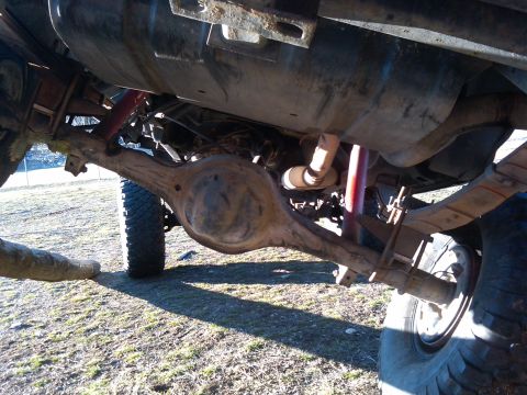 1988 Ford Bronco - Underside view of a 1988 Ford Bronco, showing the rear axle and suspension components.