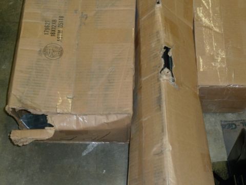 1992 Ford Mustang - Cardboard boxes show signs of damage from shipping or handling.