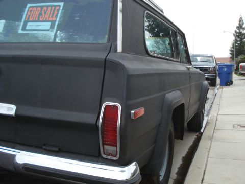1977 Jeep Cherokee - Rear view of a 1977 Jeep Cherokee with a FOR SALE sign in the back window.